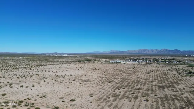 a view of an ocean beach and mountain