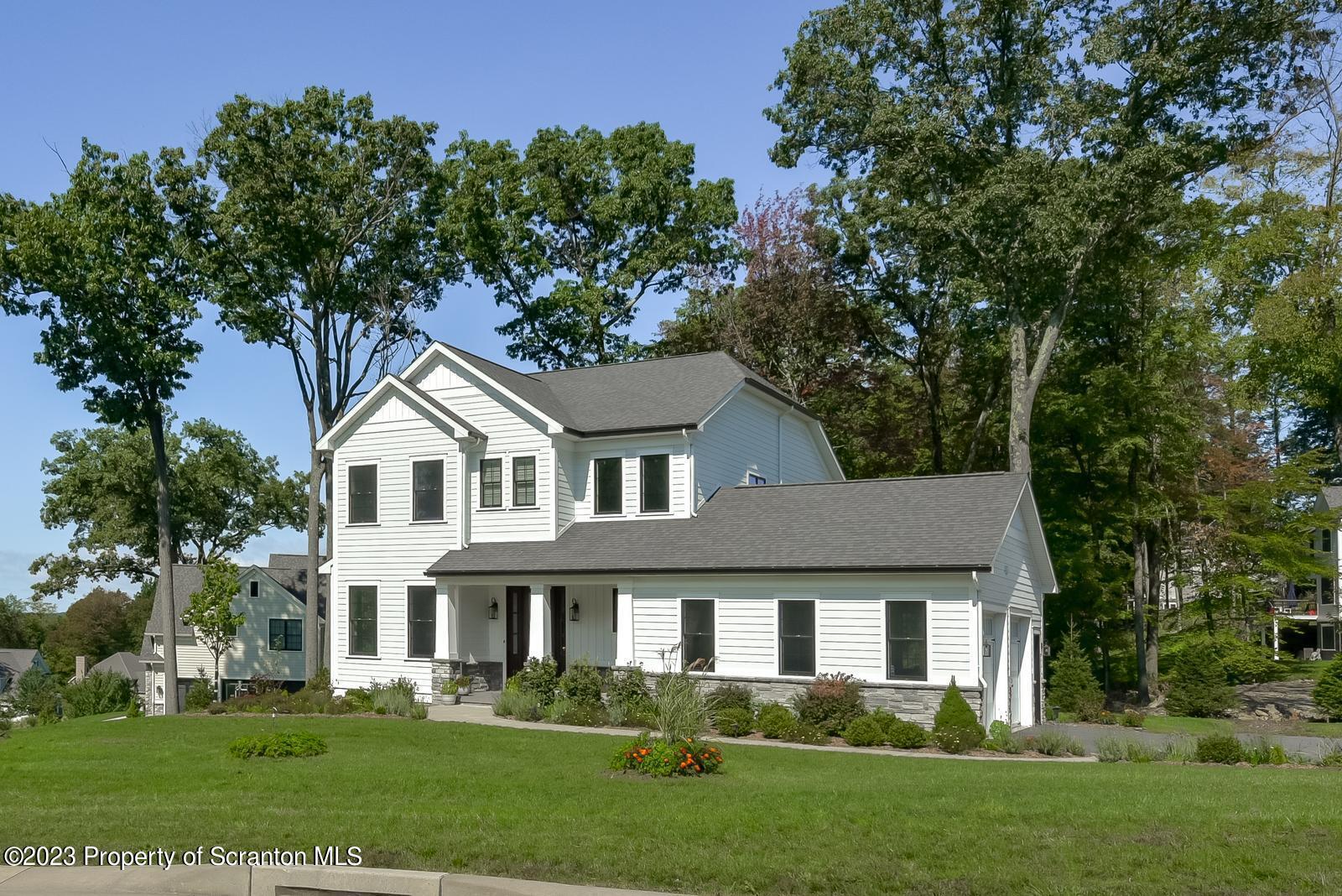 115 Rock Ridge Drive Clarks Summit, PA 18411 - Photo 1 of 43 front view of a house with a yard
