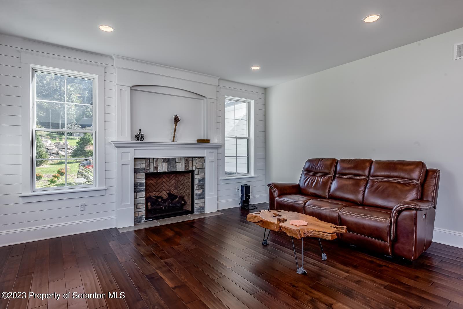 115 Rock Ridge Drive Clarks Summit, PA 18411 - Photo 11 of 43 a living room with furniture and a fireplace