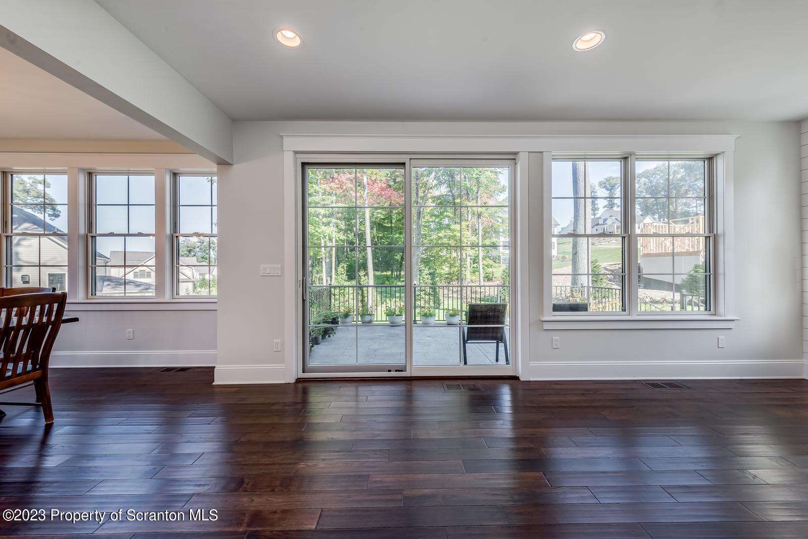 115 Rock Ridge Drive Clarks Summit, PA 18411 - Photo 12 of 43 a view of an empty room with wooden floor and a window