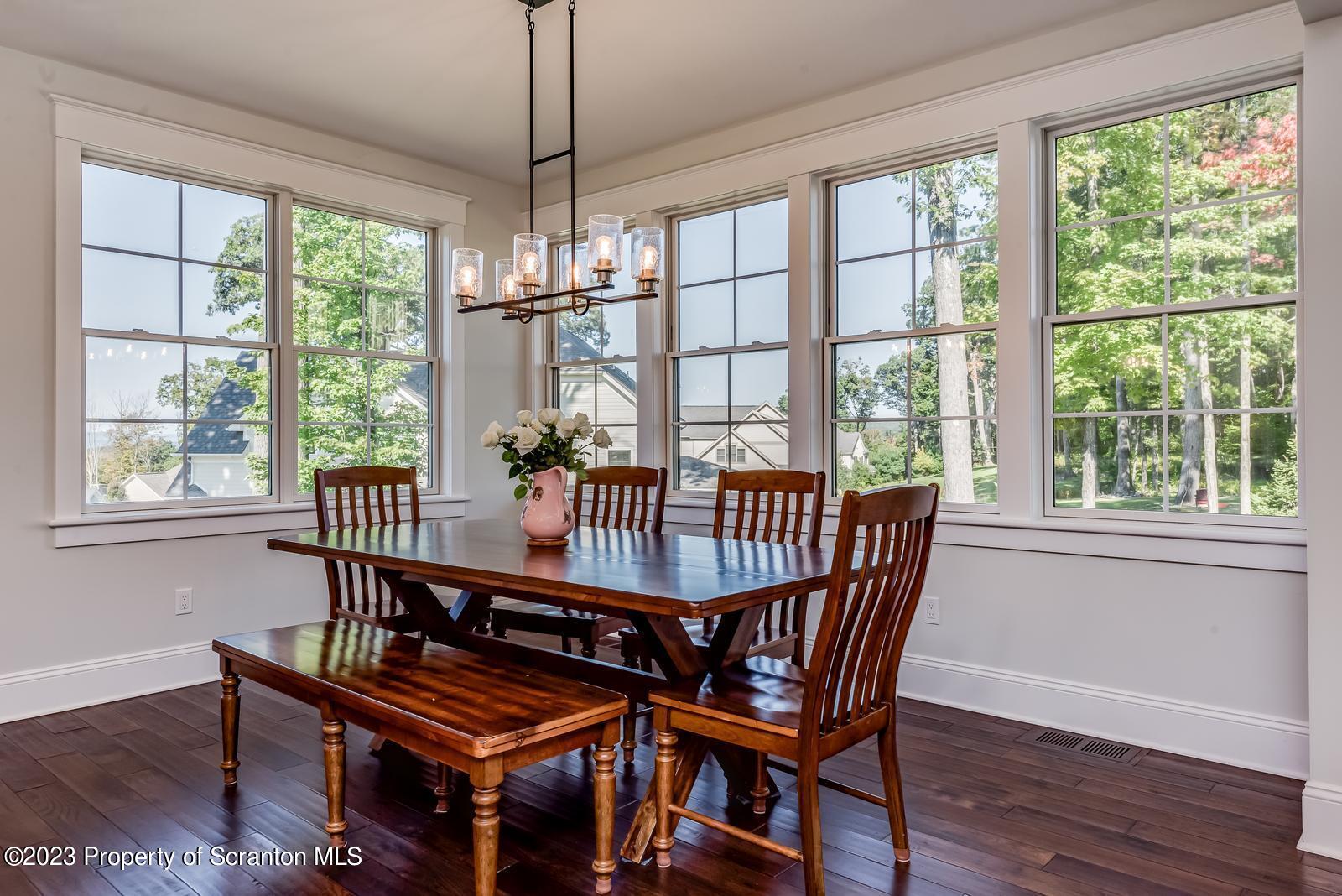 115 Rock Ridge Drive Clarks Summit, PA 18411 - Photo 13 of 43 a view of a dining room with furniture window and wooden floor