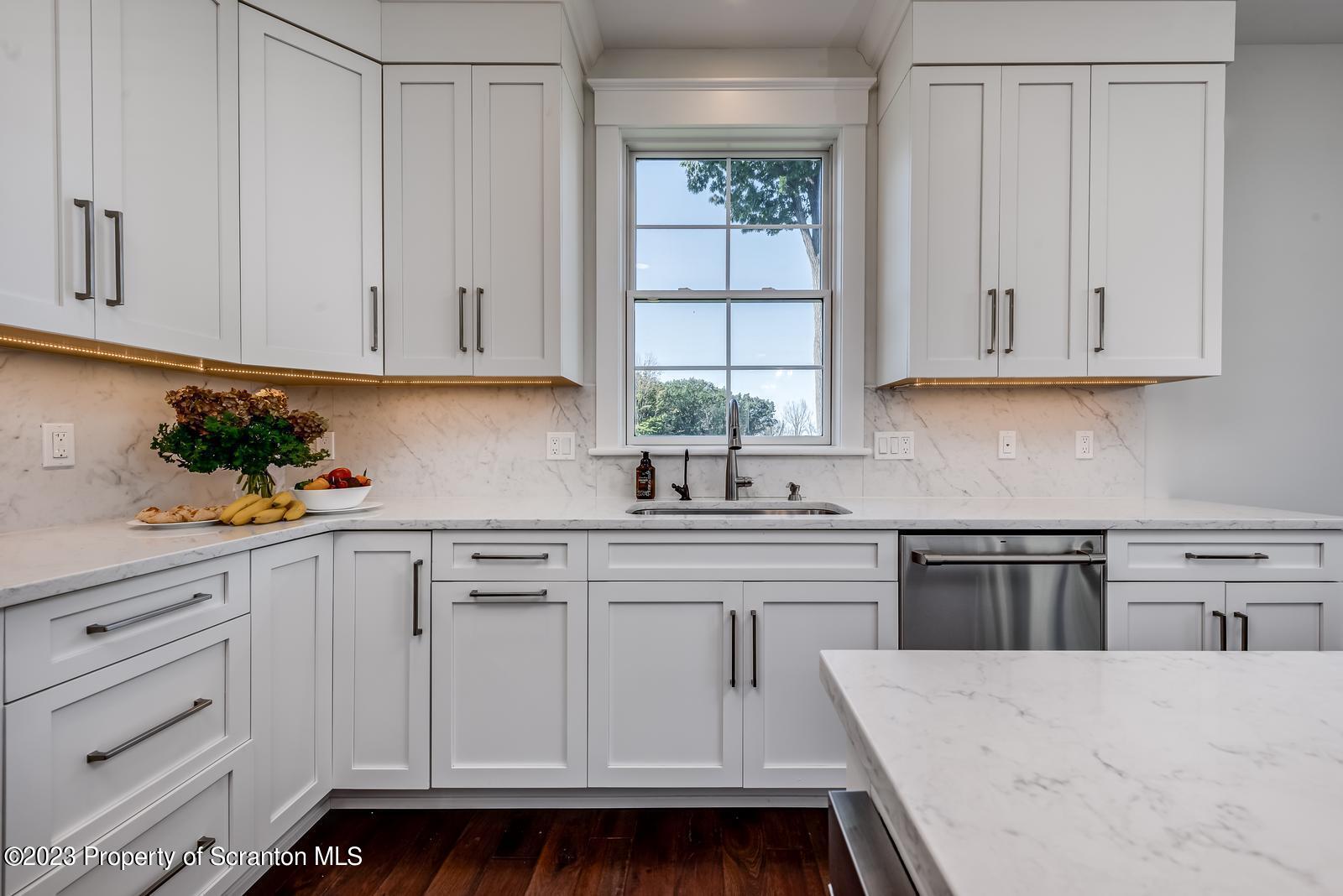 115 Rock Ridge Drive Clarks Summit, PA 18411 - Photo 20 of 43 a kitchen with white cabinets and white appliances