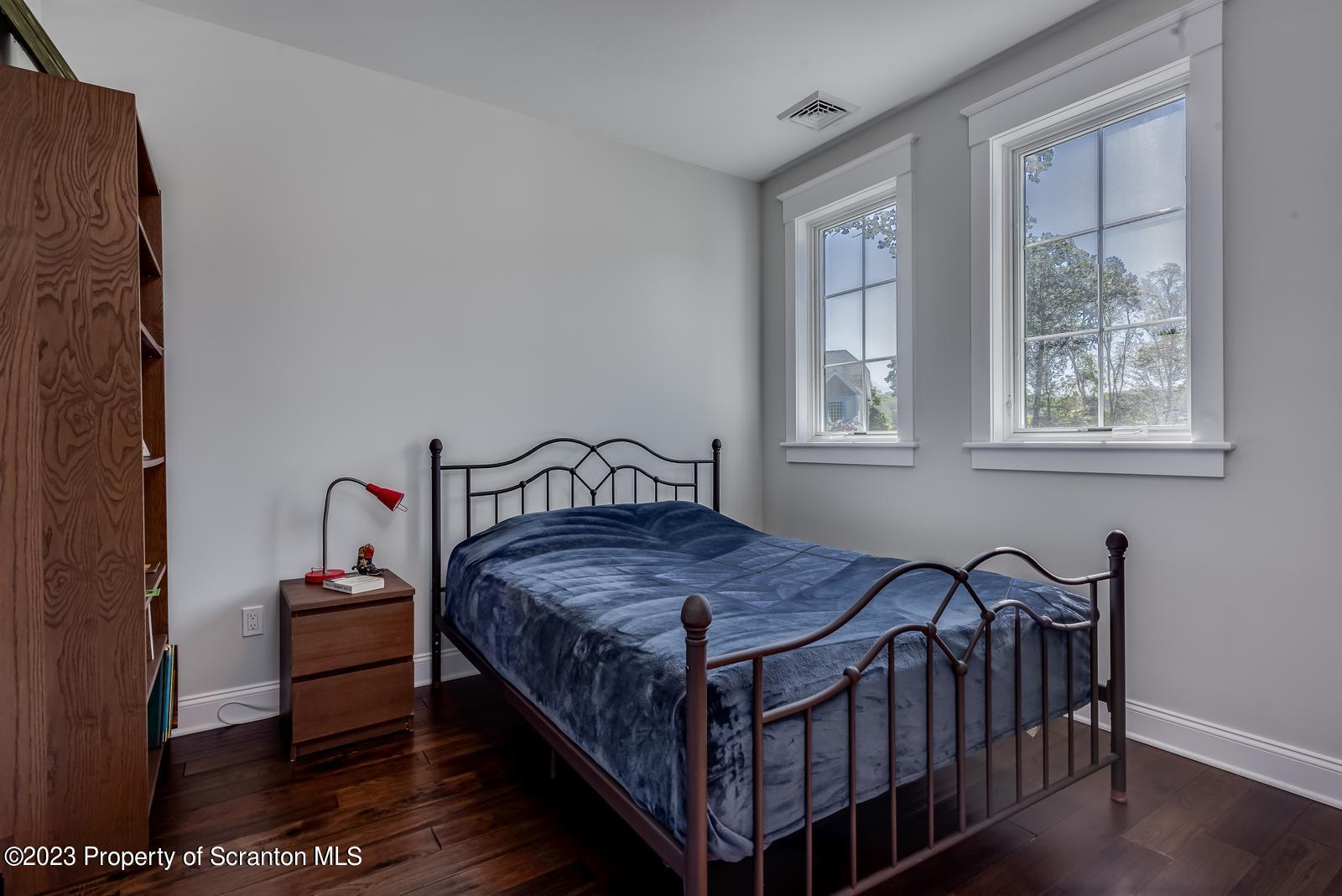 115 Rock Ridge Drive Clarks Summit, PA 18411 - Photo 22 of 43 a bedroom with a bed window and a table