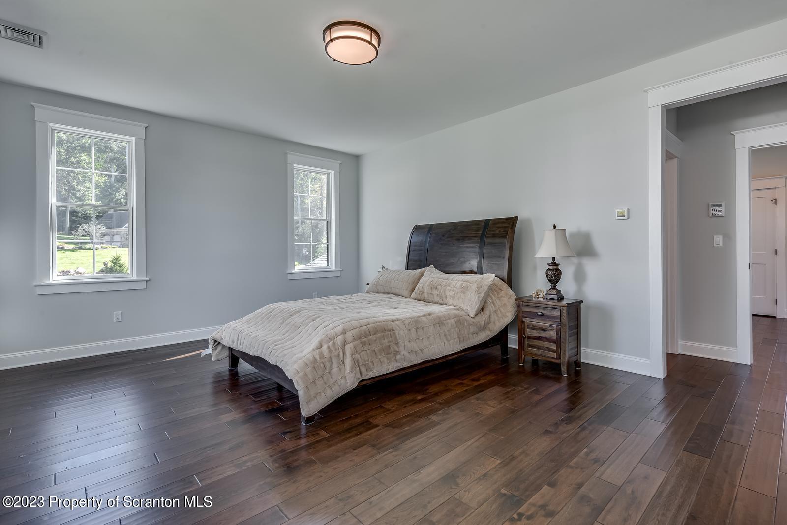 115 Rock Ridge Drive Clarks Summit, PA 18411 - Photo 26 of 43 a bedroom with a bed and wooden floor