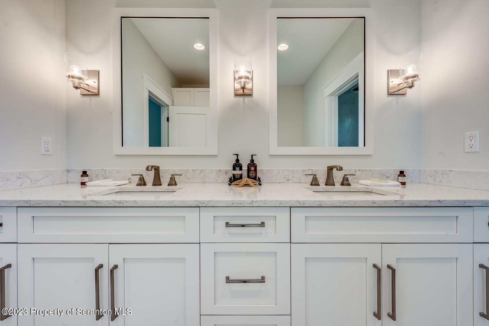 115 Rock Ridge Drive Clarks Summit, PA 18411 - Photo 31 of 43 a bathroom with sink and mirror