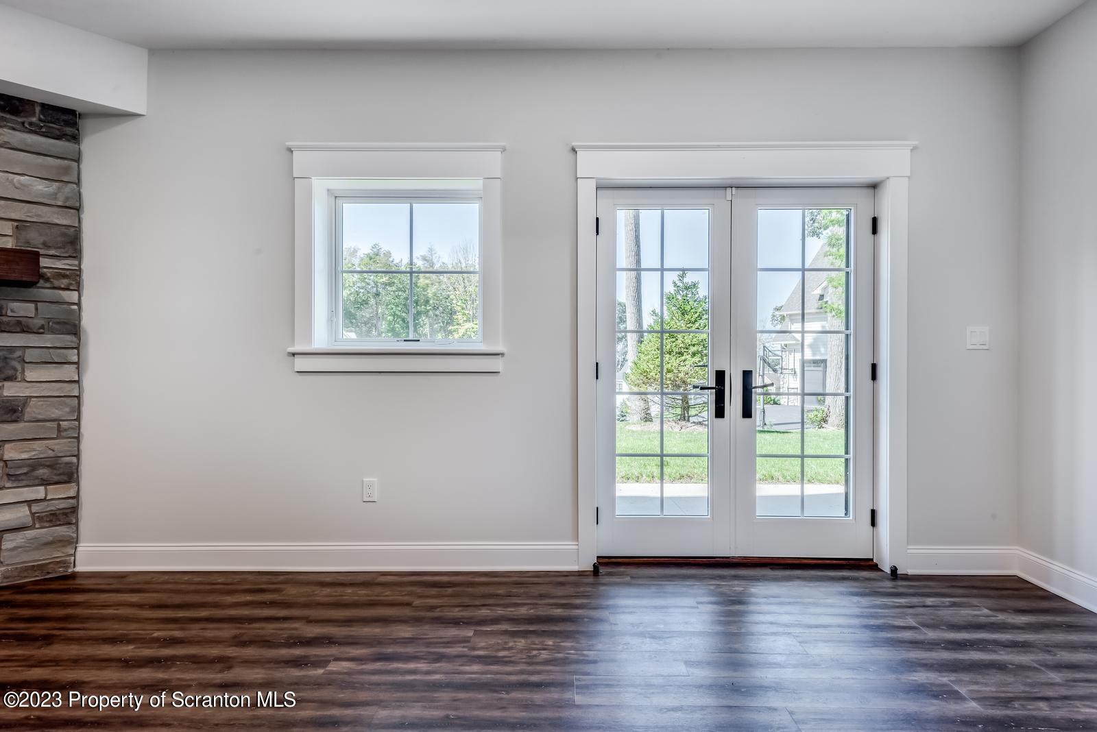 115 Rock Ridge Drive Clarks Summit, PA 18411 - Photo 34 of 43 a view of an empty room with wooden floor and a window