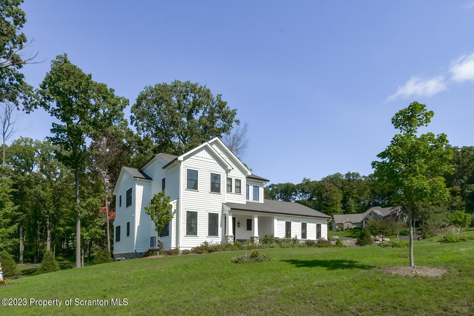 115 Rock Ridge Drive Clarks Summit, PA 18411 - Photo 39 of 43 a front view of a house with a garden