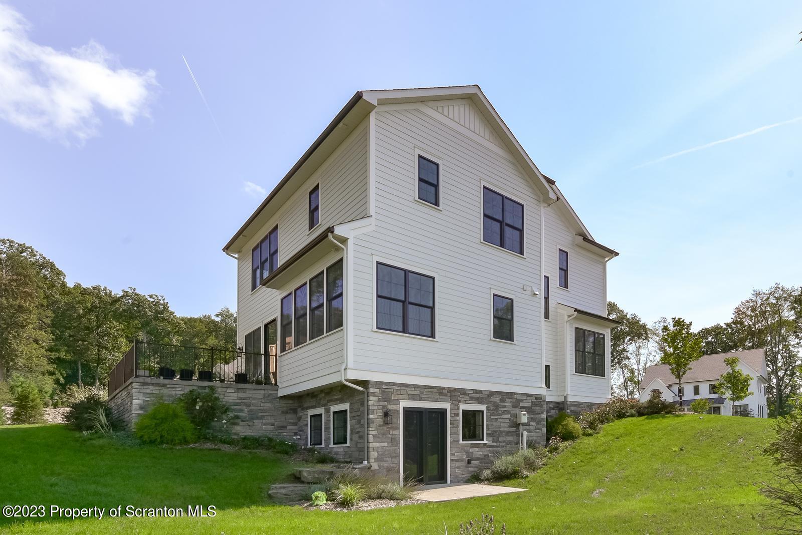 115 Rock Ridge Drive Clarks Summit, PA 18411 - Photo 41 of 43 a front view of a house with garden