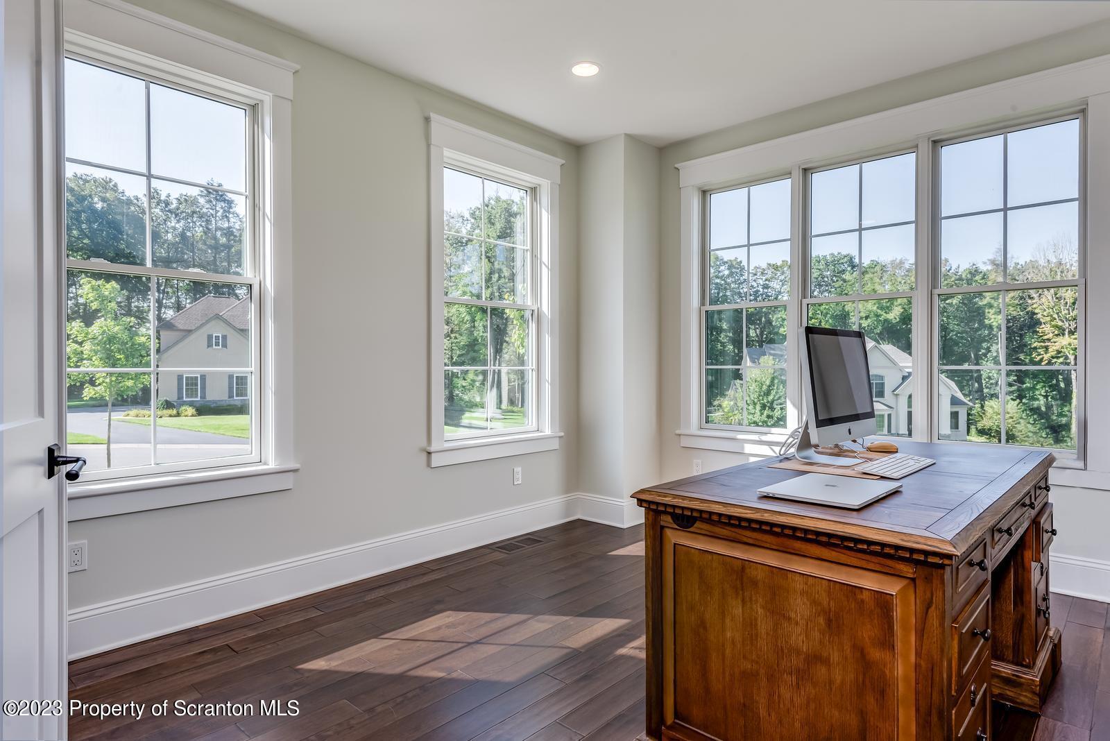 115 Rock Ridge Drive Clarks Summit, PA 18411 - Photo 5 of 43 a view of a dining room with furniture and windows
