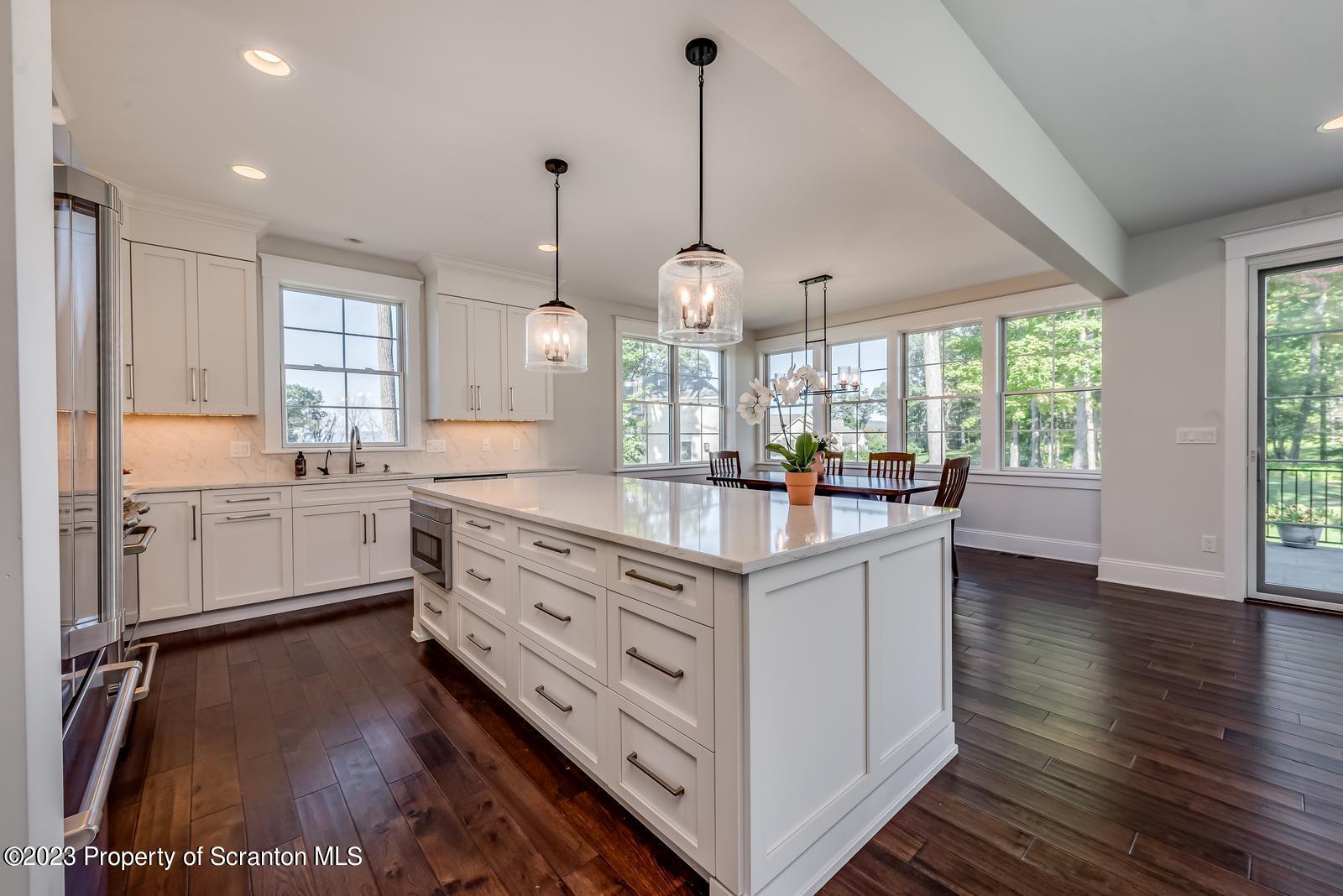 115 Rock Ridge Drive Clarks Summit, PA 18411 - Photo 10 of 43 a kitchen with granite countertop a sink appliances cabinets and a counter top space