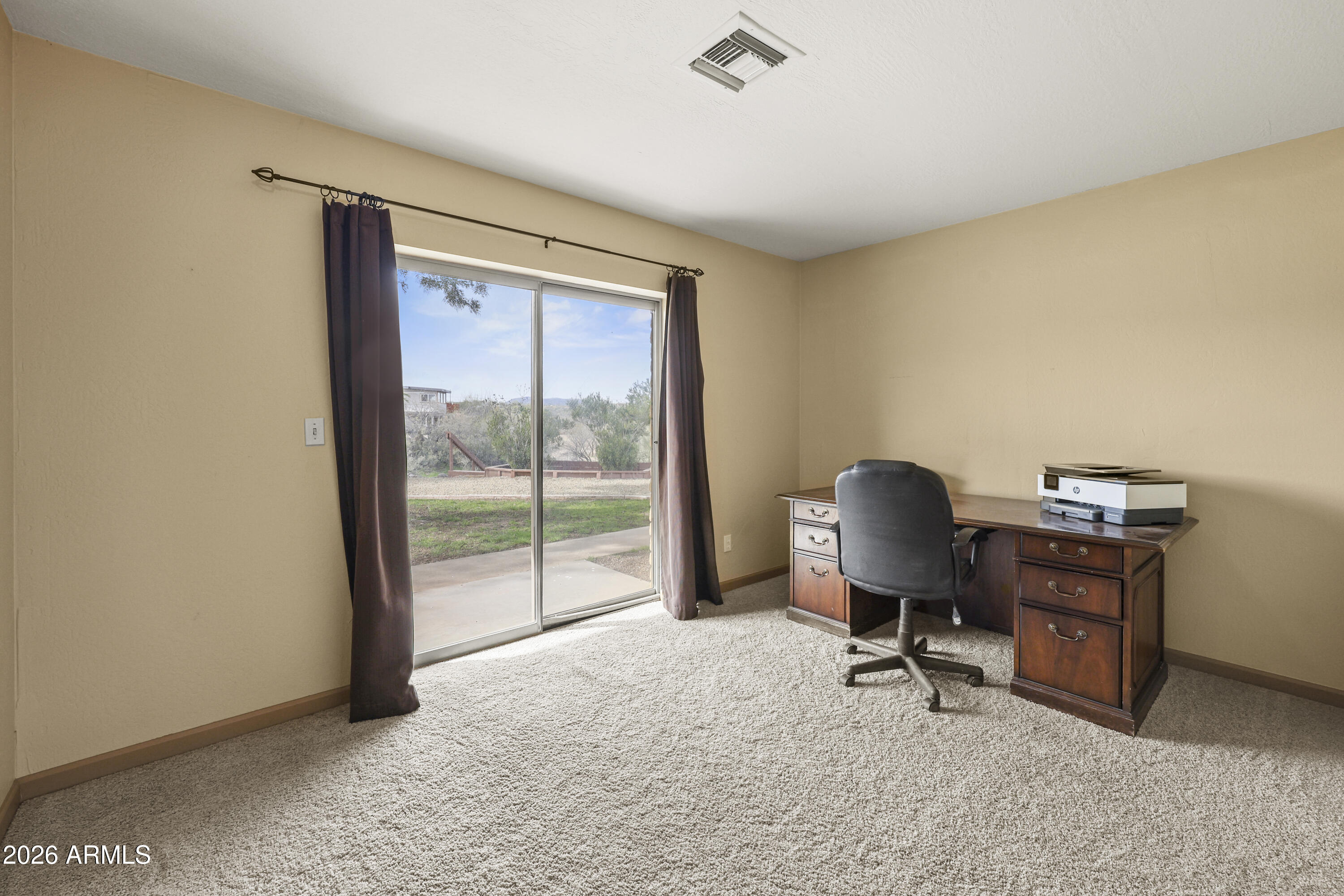 1890 West Roderick Lane Wickenburg, AZ 85390 - Photo 12 of 41 a view of workspace with furniture and a window