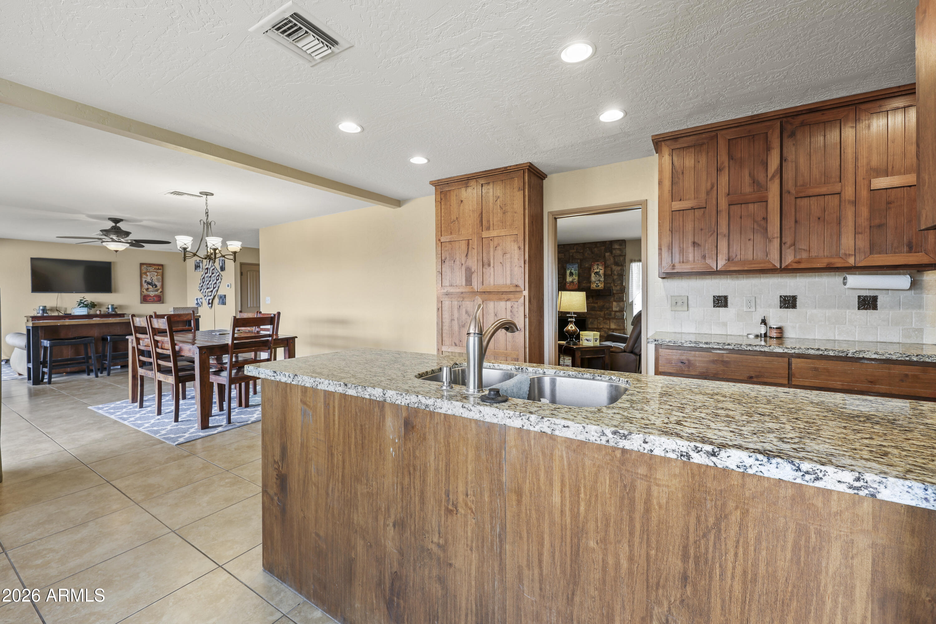 1890 West Roderick Lane Wickenburg, AZ 85390 - Photo 15 of 41 a kitchen with lots of counter space and windows