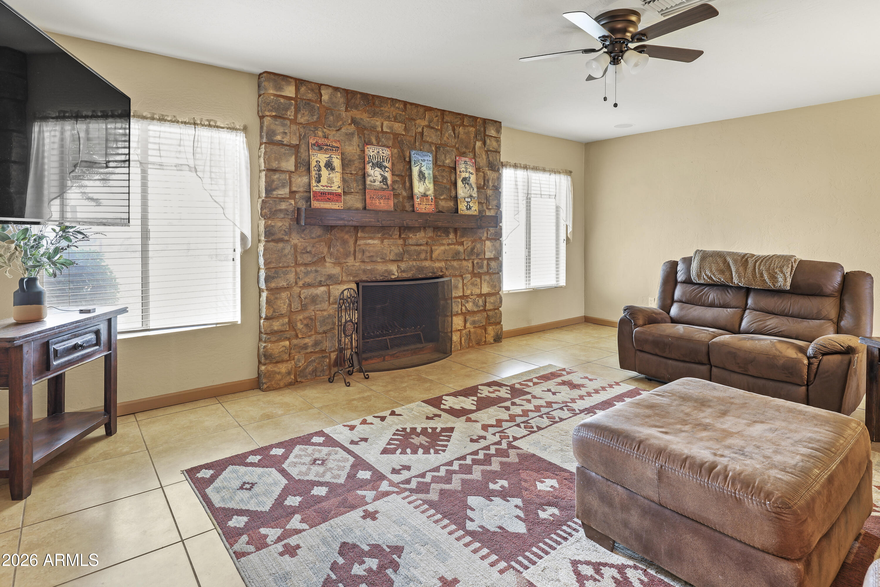 1890 West Roderick Lane Wickenburg, AZ 85390 - Photo 22 of 41 a bedroom with a bed and a couch