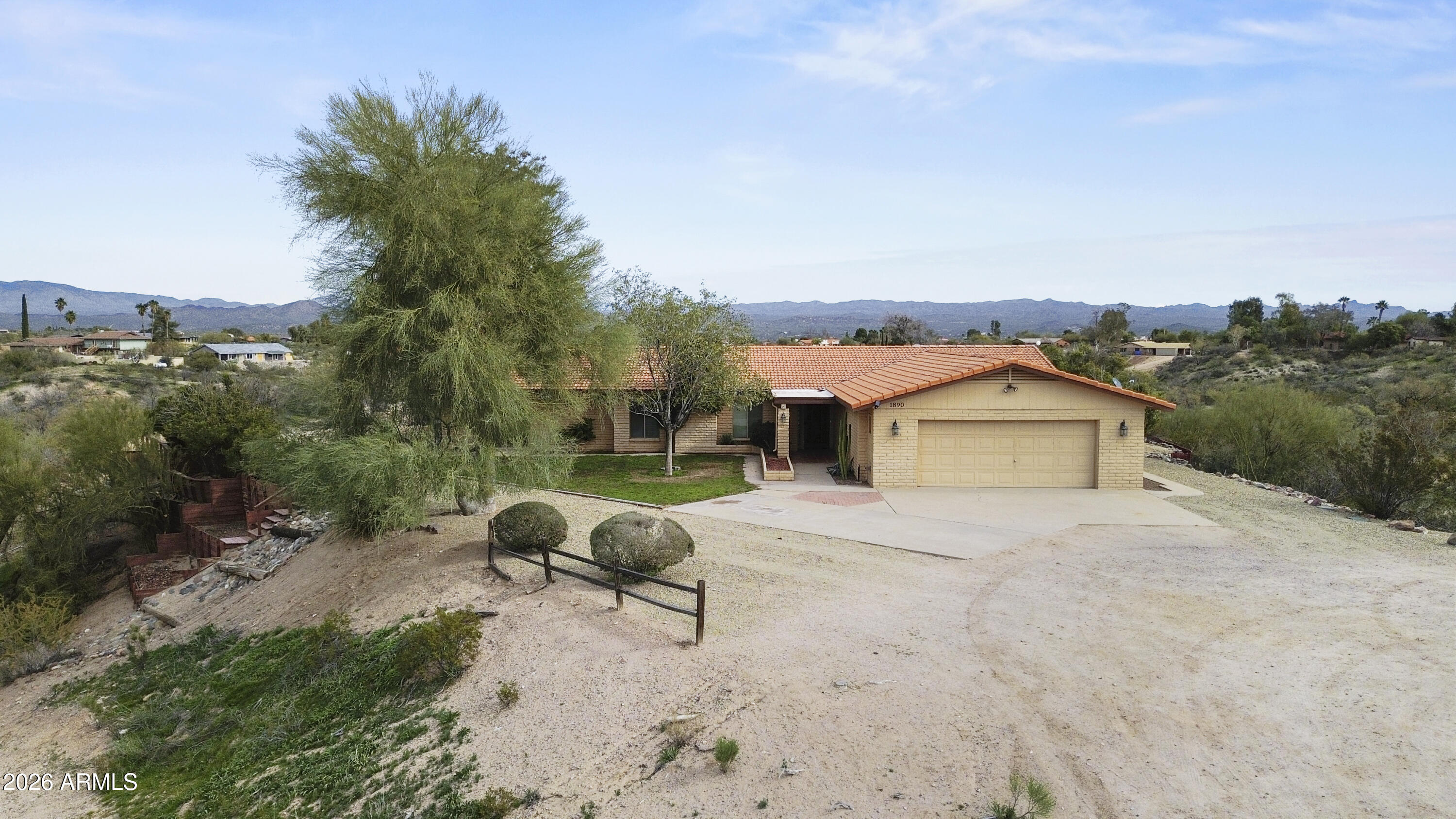 1890 West Roderick Lane Wickenburg, AZ 85390 - Photo 36 of 41 a view of a house with a yard