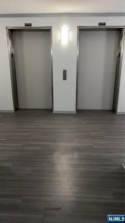 a view of room with wooden floor