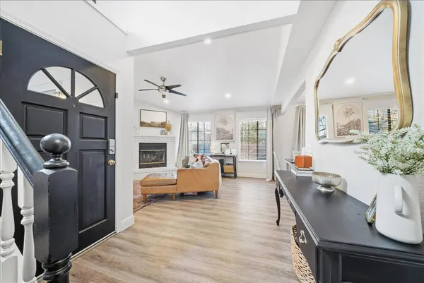 a living room with fireplace furniture and a flat screen tv