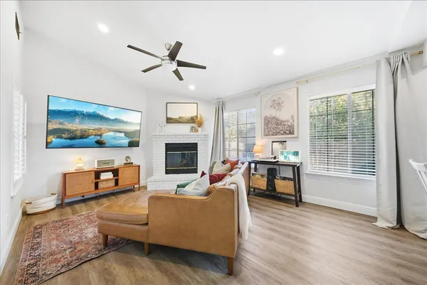 a living room with furniture and a fireplace