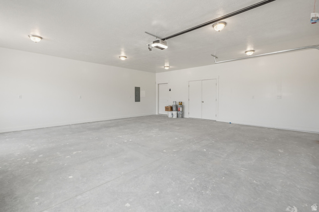 157 West 100 South Joseph, UT 84739 - Photo 27 of 30 Garage with electric panel and a garage door opener