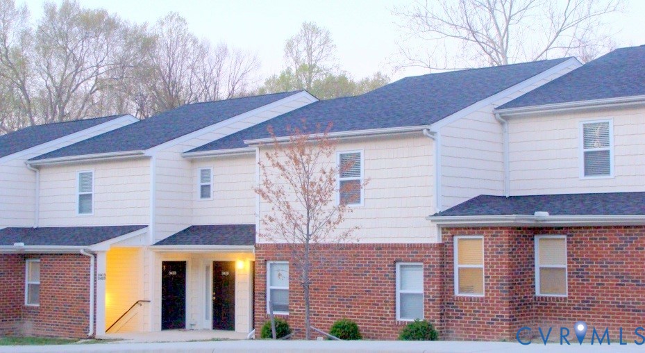 3415 Prince George Drive Prince George, VA 23875 - Photo 1 of 9 a front view of a house with large windows