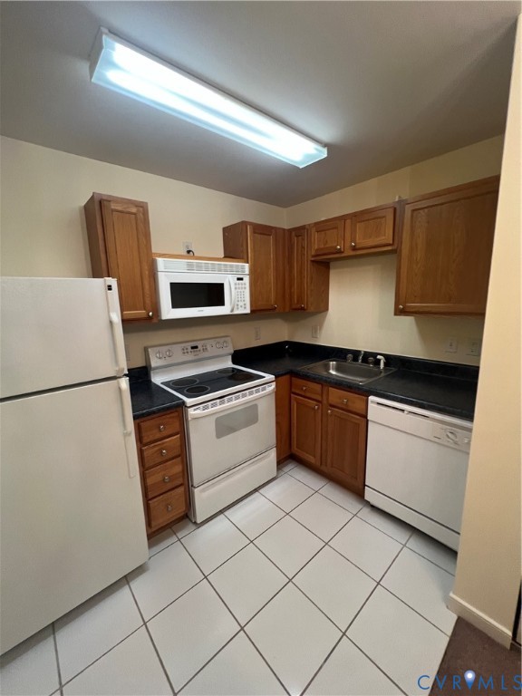 3415 Prince George Drive Prince George, VA 23875 - Photo 5 of 9 a kitchen with granite countertop a refrigerator stove top oven and sink