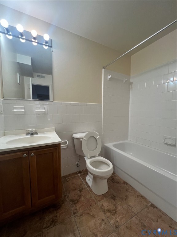 3415 Prince George Drive Prince George, VA 23875 - Photo 8 of 9 a bathroom with a sink toilet a mirror a bathtub and shower