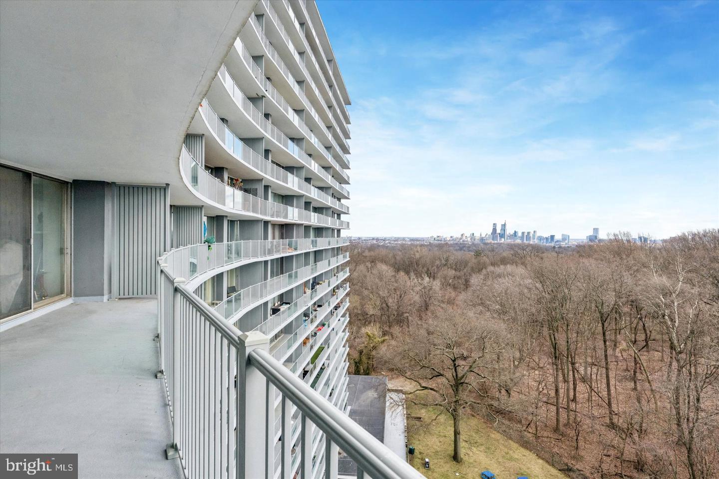 3900-00 West Ford Road, Unit 14K Philadelphia, PA 19131 - Photo 15 of 42 Modern balcony with city skyline view.