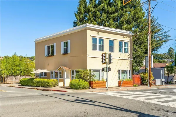 a view of a house with a street