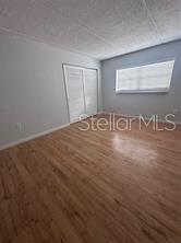525 South Conway Road, Unit 54 Orlando, FL 32807 - Photo 8 of 16 an empty room with windows