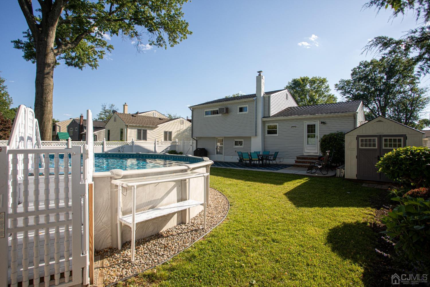 25 Finley Road Edison, NJ 08817 - Photo 13 of 51 a swimming pool view with a outdoor seating space