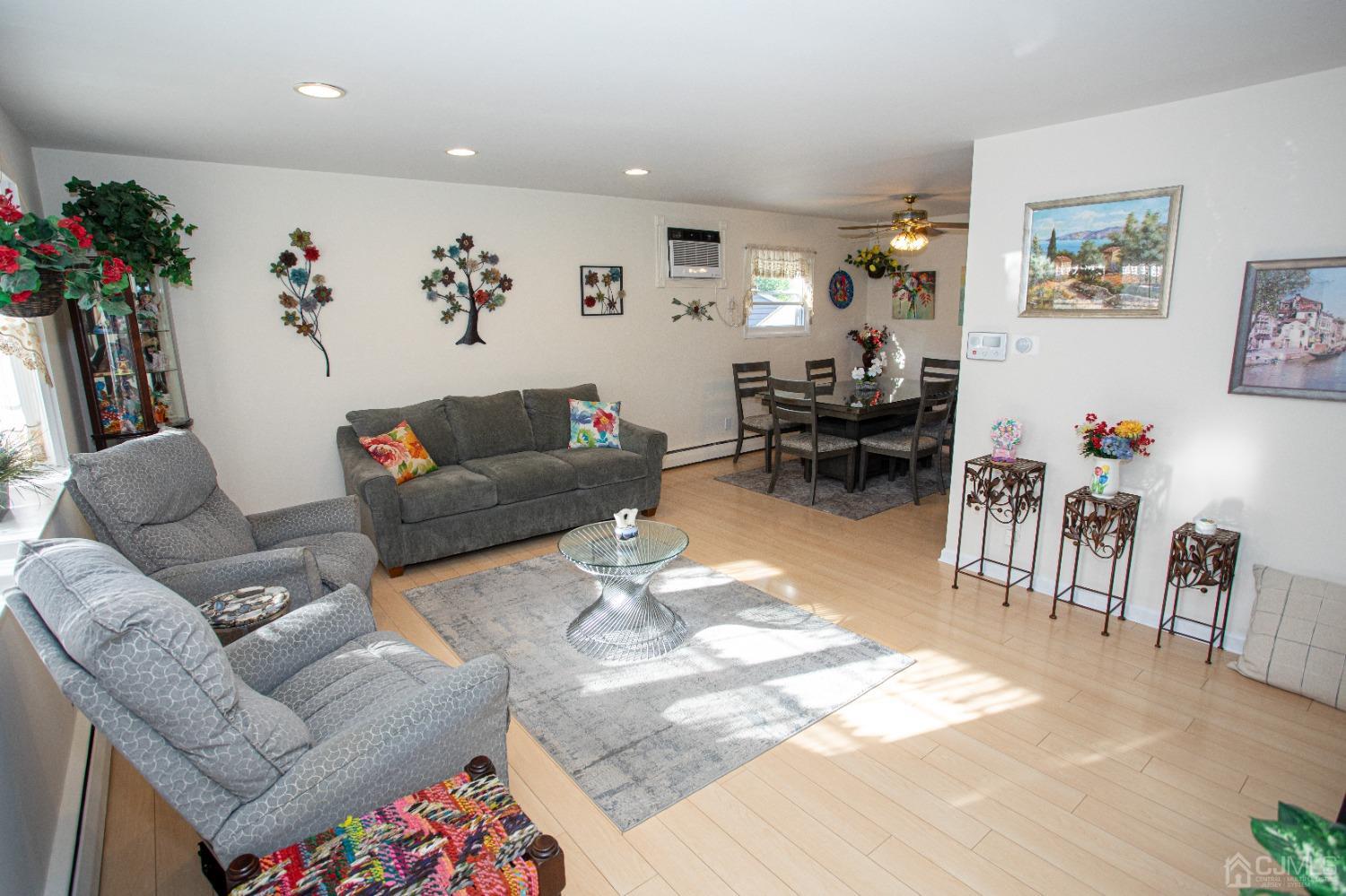 25 Finley Road Edison, NJ 08817 - Photo 20 of 51 a living room with furniture and a large window