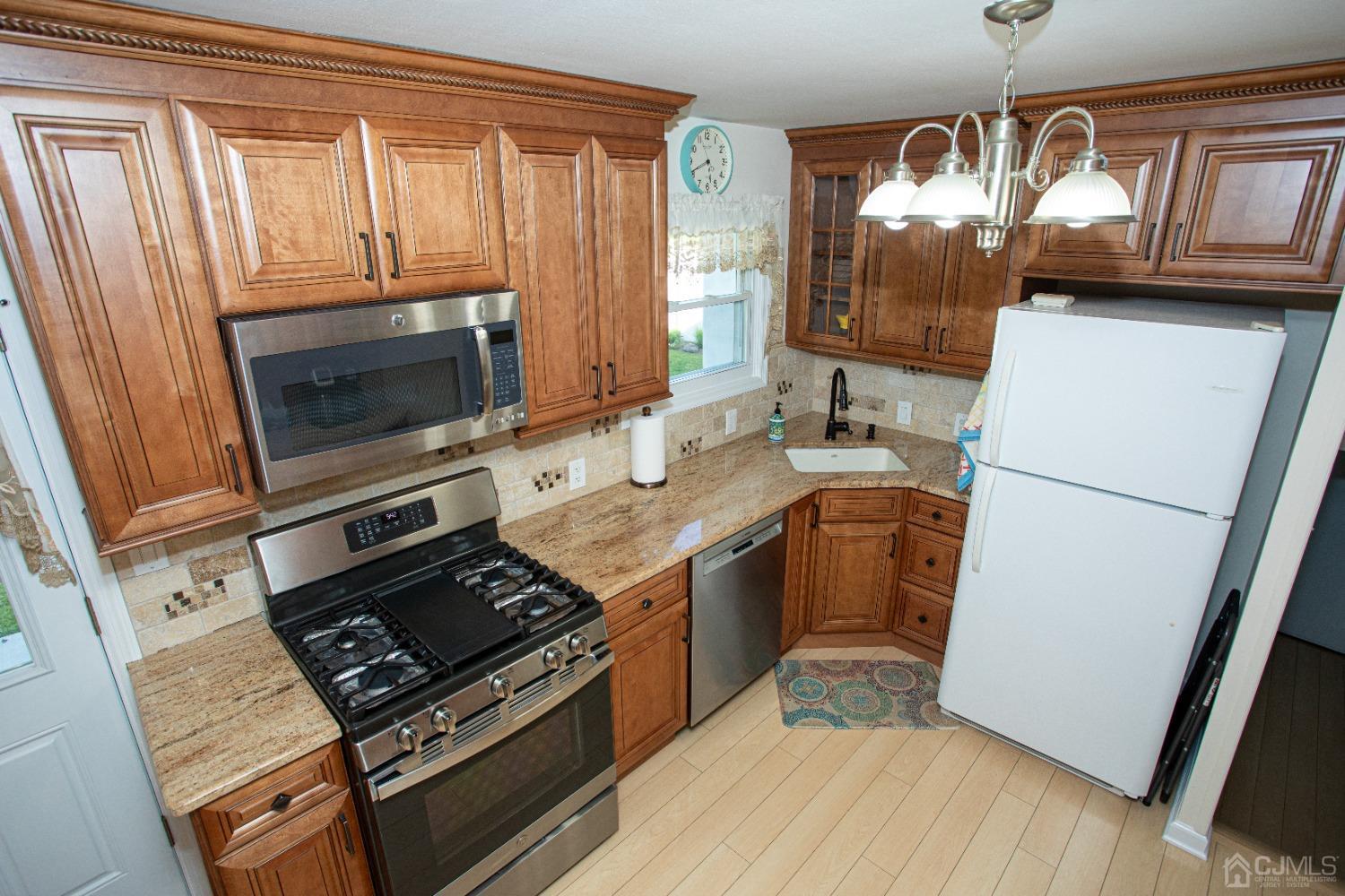 25 Finley Road Edison, NJ 08817 - Photo 24 of 51 a kitchen with a stove microwave and refrigerator