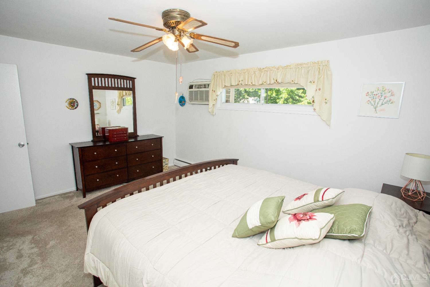 25 Finley Road Edison, NJ 08817 - Photo 27 of 51 a bedroom with a bed and a dresser