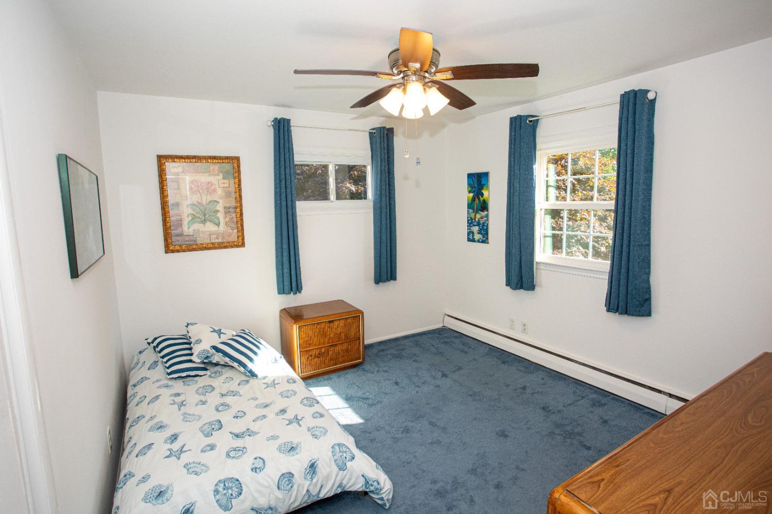 25 Finley Road Edison, NJ 08817 - Photo 28 of 51 a bedroom with a bed couch and window