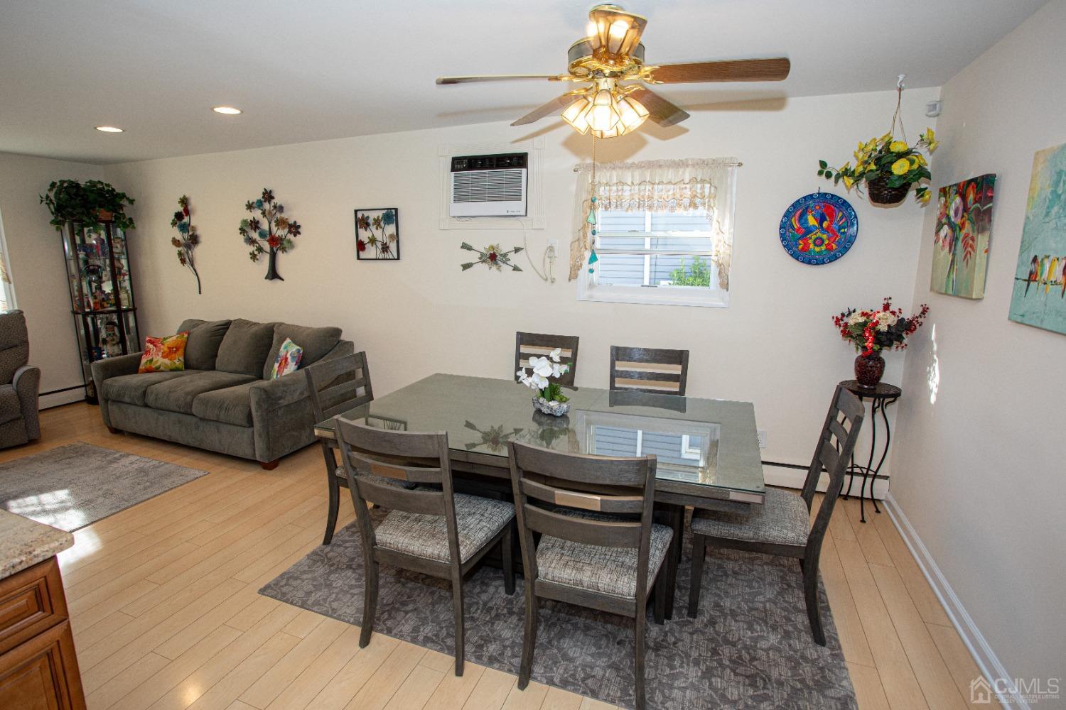 25 Finley Road Edison, NJ 08817 - Photo 3 of 51 a living room with furniture and a chandelier
