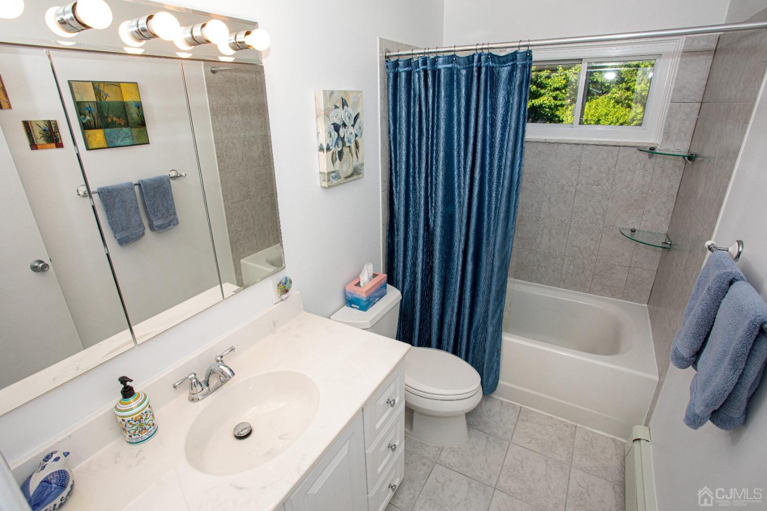 25 Finley Road Edison, NJ 08817 - Photo 33 of 51 a bathroom with a sink a toilet and shower