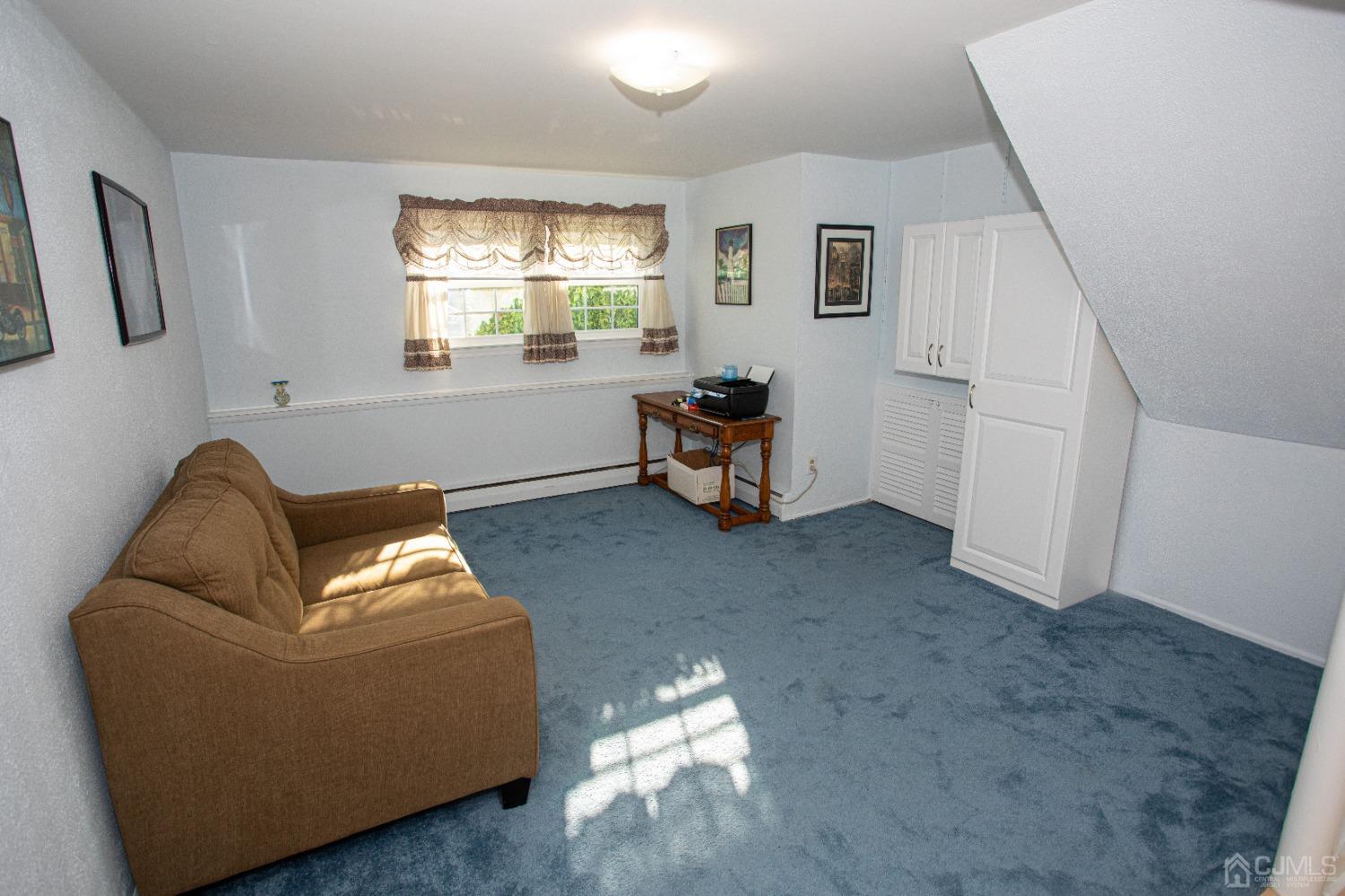 25 Finley Road Edison, NJ 08817 - Photo 38 of 51 a living room with furniture and a window