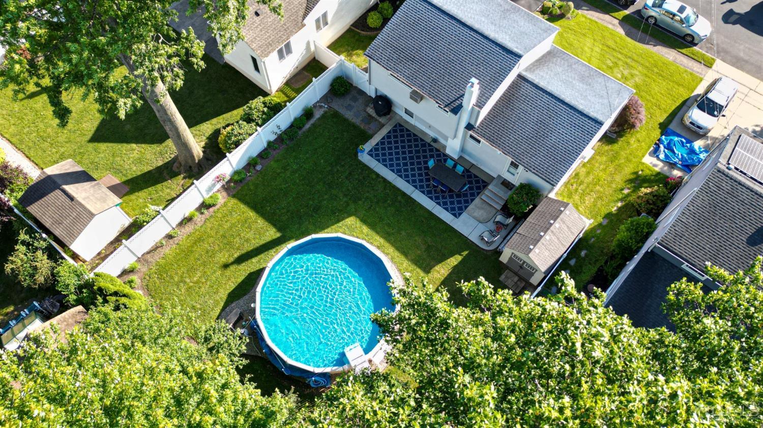 25 Finley Road Edison, NJ 08817 - Photo 49 of 51 an aerial view of a house with swimming pool and garden