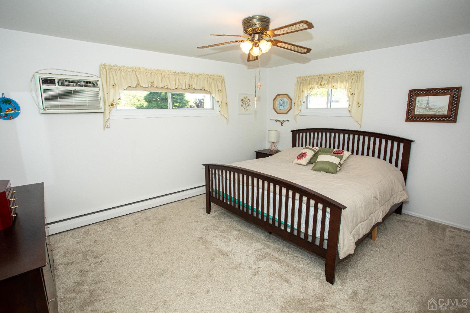25 Finley Road Edison, NJ 08817 - Photo 5 of 51 a bedroom with a bed and a window