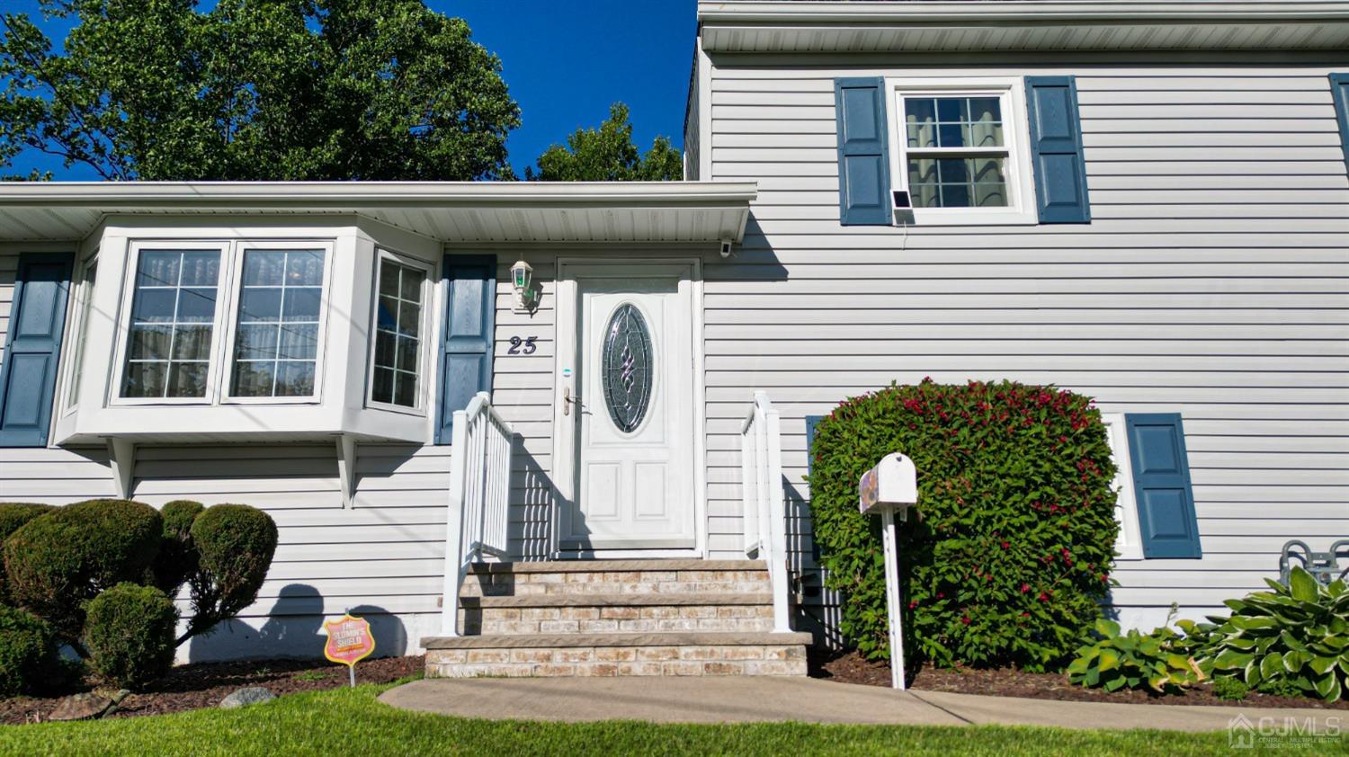 25 Finley Road Edison, NJ 08817 - Photo 51 of 51 a front view of a house with garden