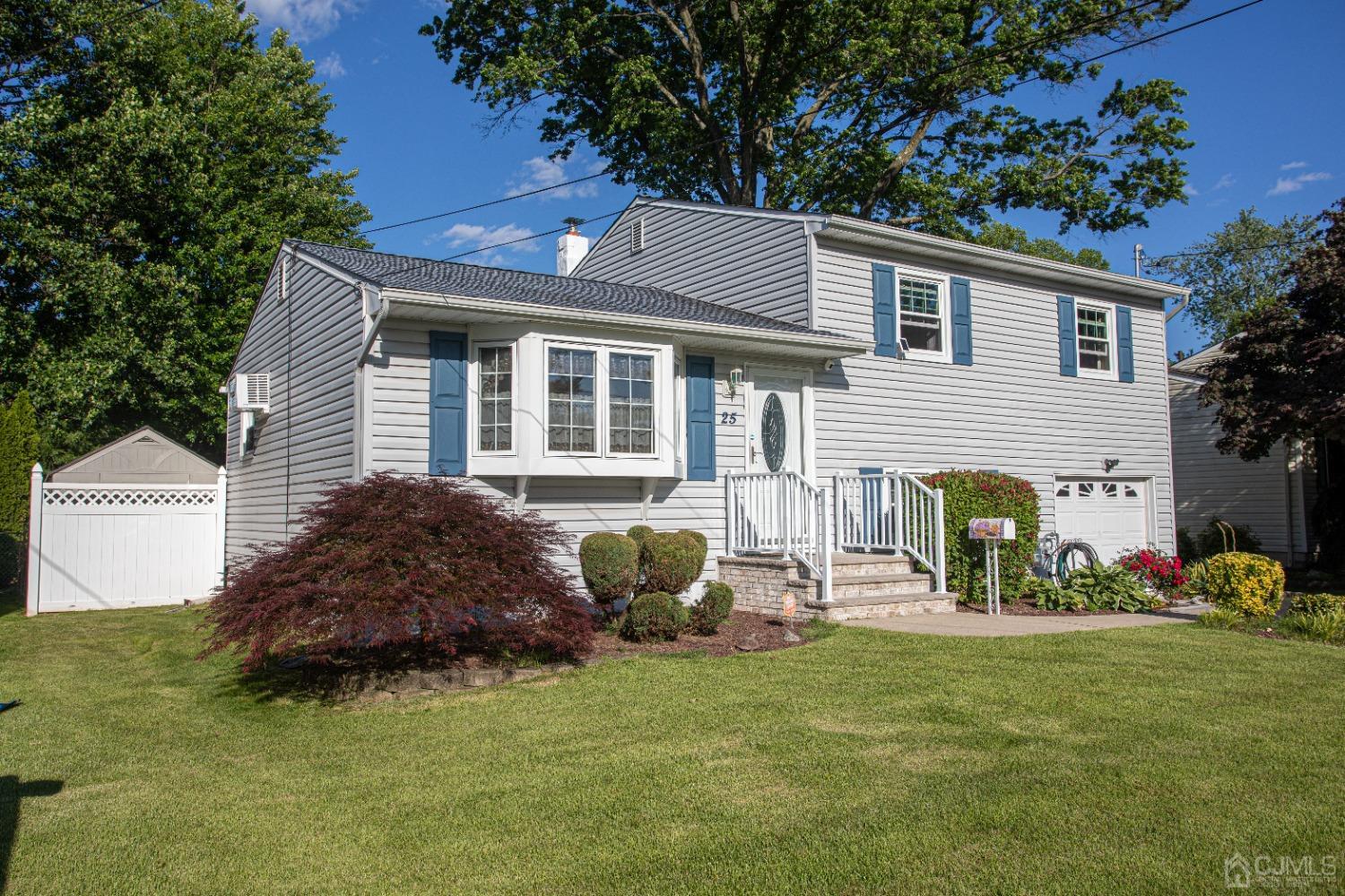 25 Finley Road Edison, NJ 08817 - Photo 8 of 51 a front view of a house with garden