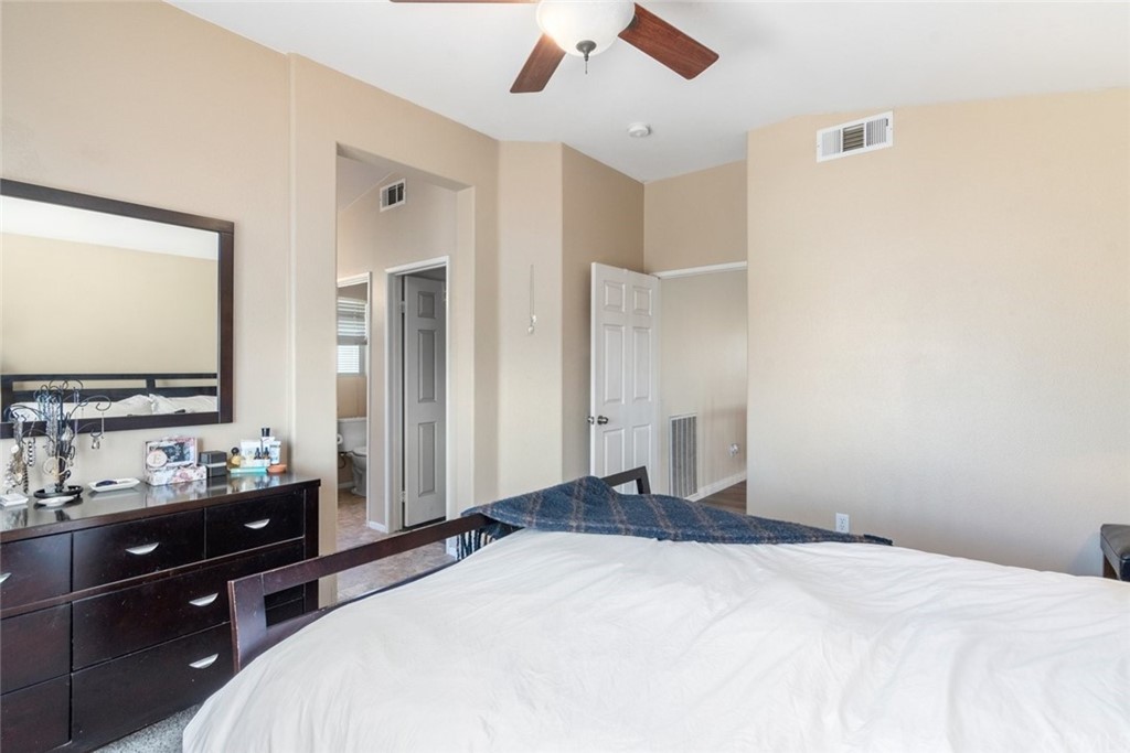 5624 Pheasant Drive Fontana, CA 92336 - Photo 15 of 20 a bedroom with a bed and a dresser