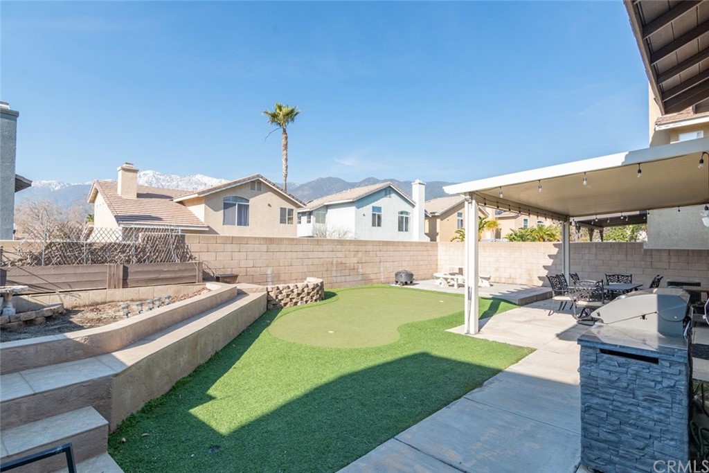 5624 Pheasant Drive Fontana, CA 92336 - Photo 17 of 20 a view of a house with a swimming pool