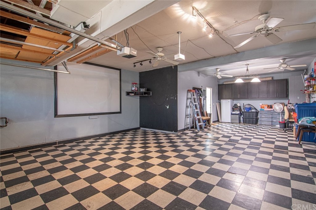 5624 Pheasant Drive Fontana, CA 92336 - Photo 20 of 20 a living room with a black white checkered floor with a black white checkered floor
