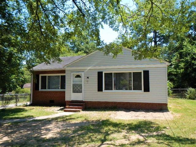 4506 Forrest Road Columbus, GA 31907 - Photo 1 of 3 a front view of a house with a yard