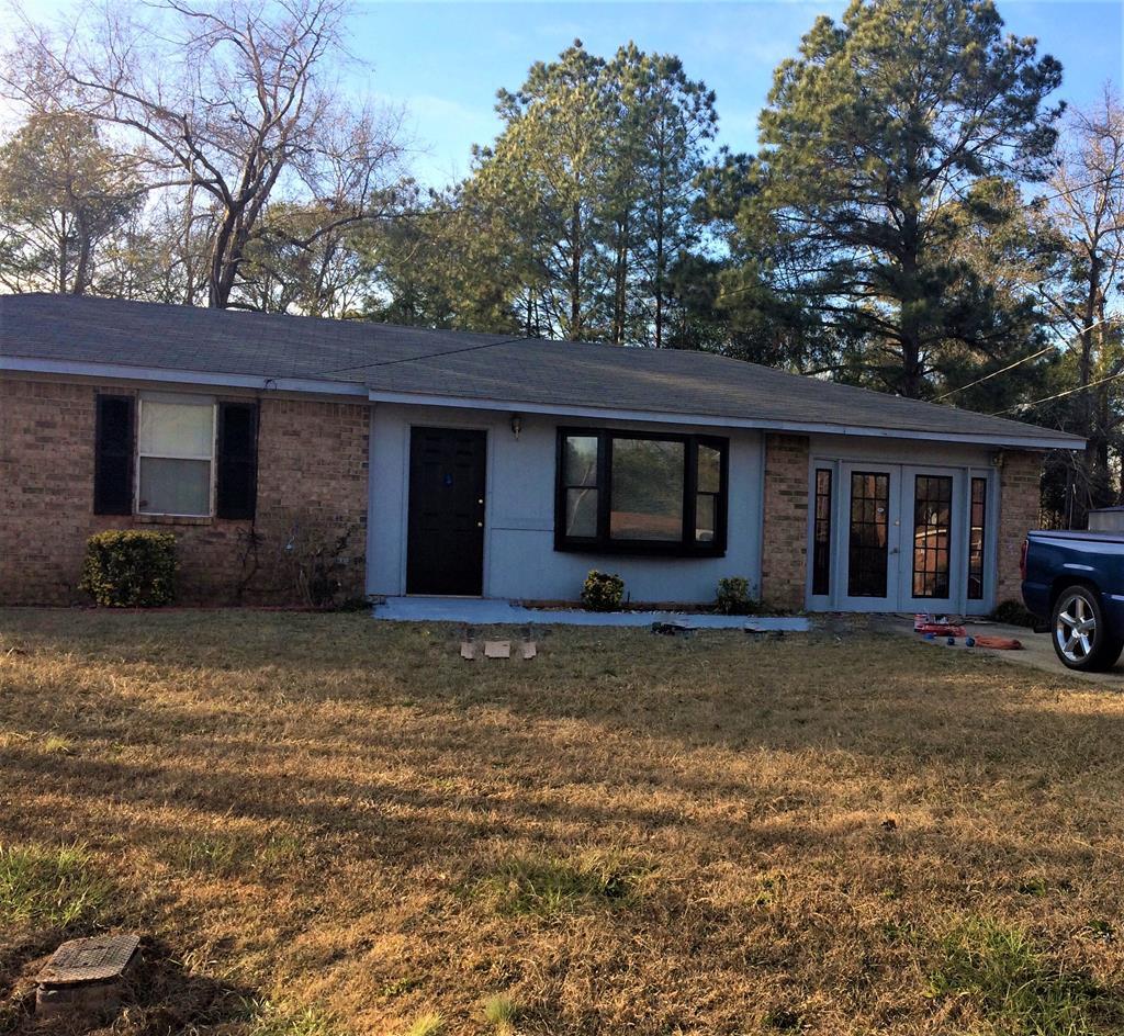 4506 Forrest Road Columbus, GA 31907 - Photo 3 of 3 a house that has a tree in front of it