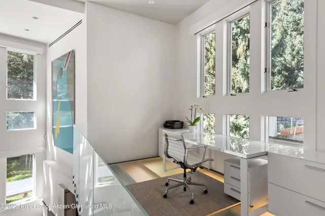 a view of a room with a window and dining table