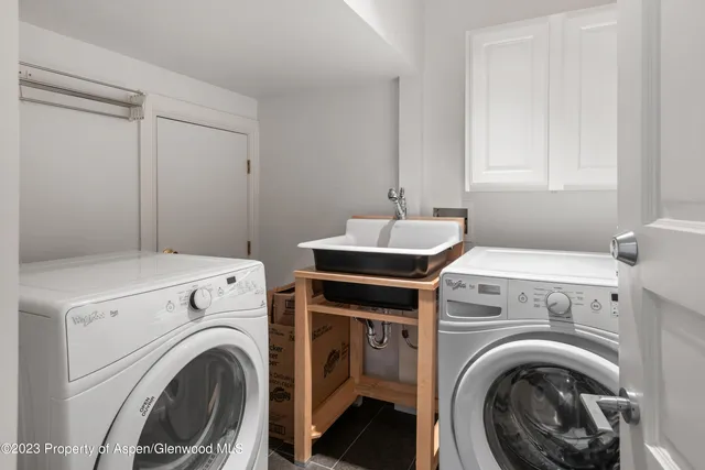 a utility room with dryer and washer