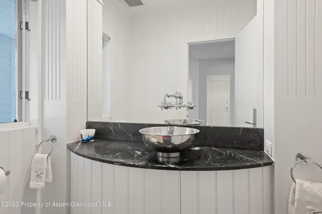 a close view of a sink and a dining table