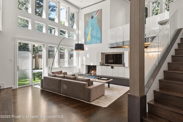a living room with furniture and flat screen tv