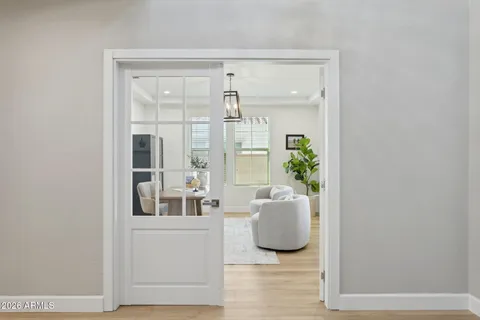 a dining room with furniture and window